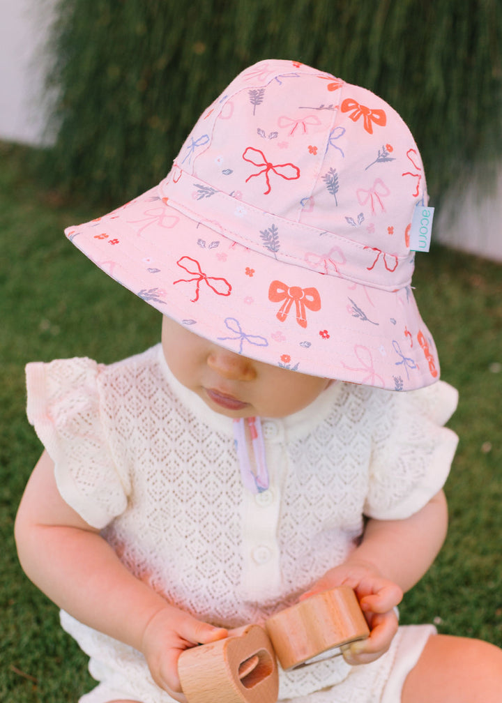 ACORN KIDS - SOFT JERSEY SUNHAT: LITTLE BOWS [sz:S - 50CM/9-18 MTHS]