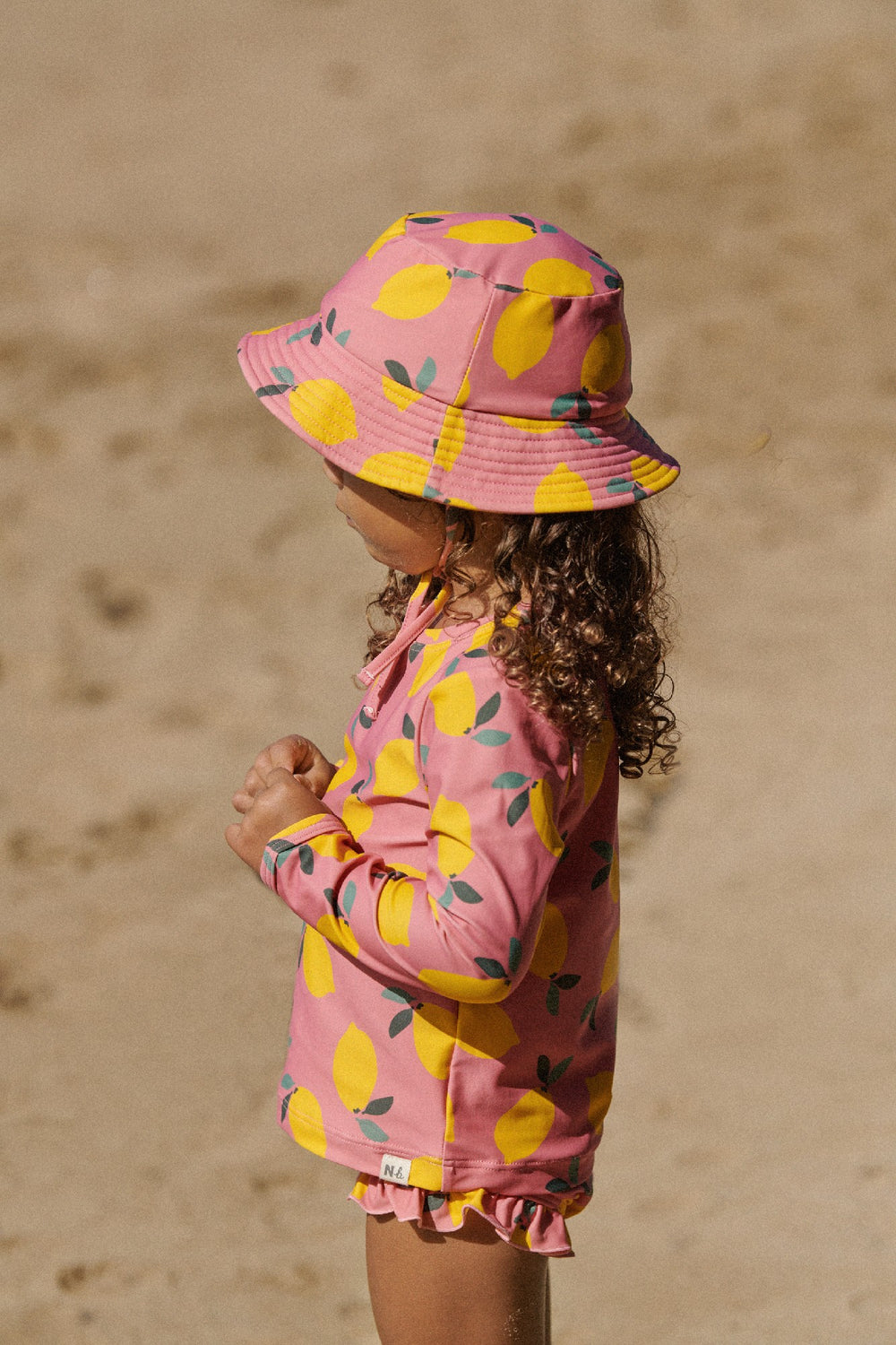 NATURE BABY - RUFFLE SWIM SHORTS: LEMMONY ROSE PRINT [sz:6-12 MTHS]