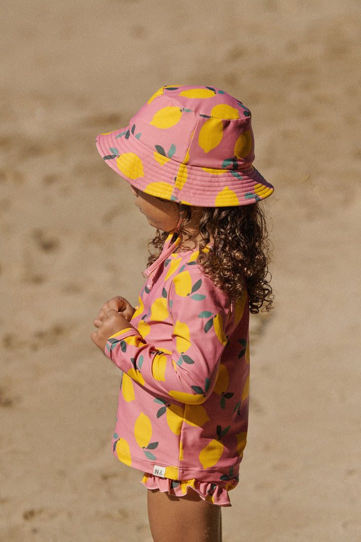 NATURE BABY - RUFFLE SWIM SHORTS: LEMMONY ROSE PRINT [sz:6-12 MTHS]