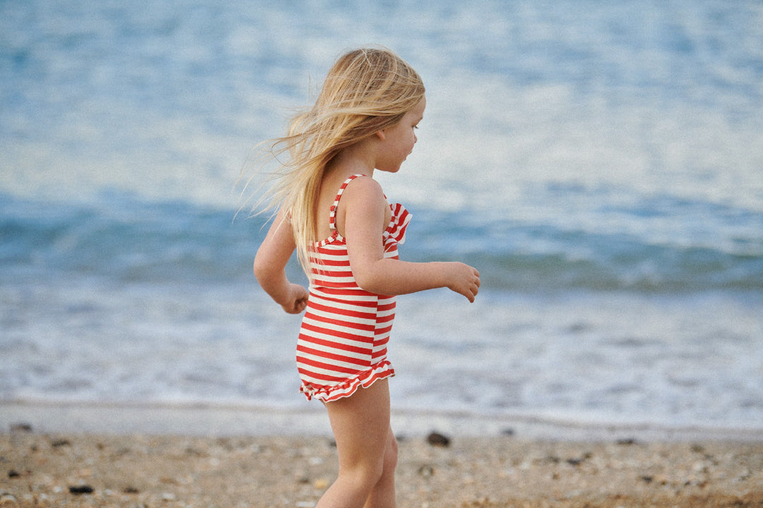 NATURE BABY - FRILL SWIMSUIT: RED SEA STRIPE [sz:6-12 MTHS]